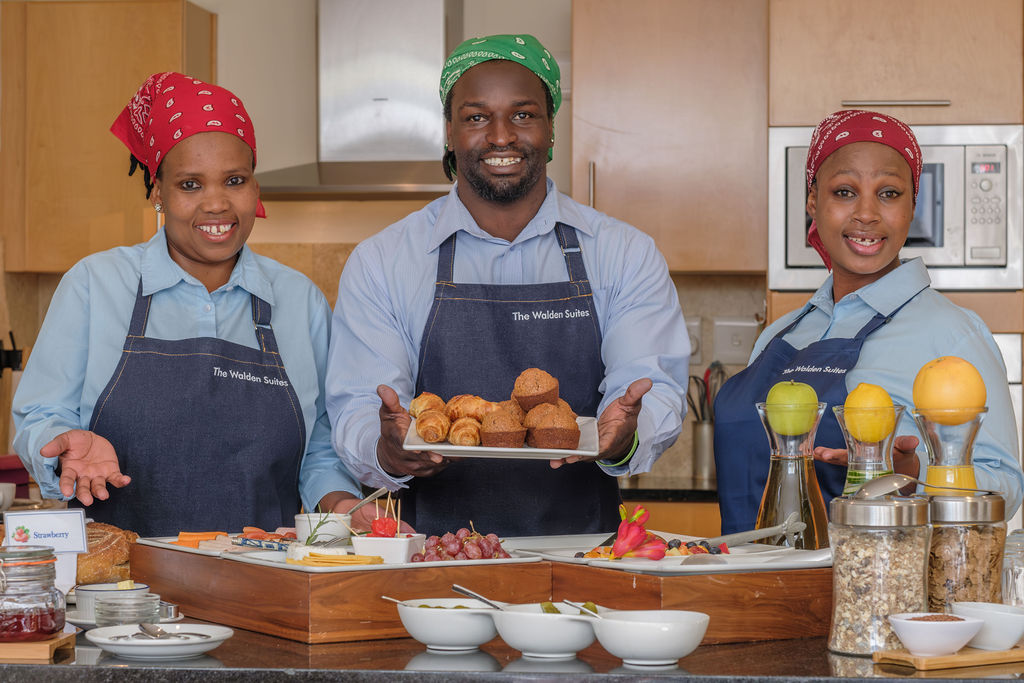 The breakfast team with a tray of pastries baked that morning